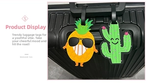 Close-up of flexible silicone luggage tags with cartoon pineapple and cactus designs