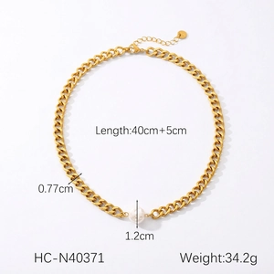 Detail of gold Cuban chain necklace with white pearl pendant showing size measurements