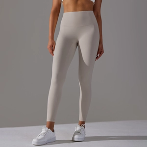 Detail view of high waist yoga leggings in light beige featuring seamless butt lift design