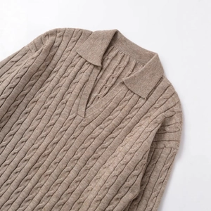 Oatmeal cable knit polo sweater featuring a V-neck lapel and warm textured finish