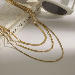 Three-piece layered gold titanium steel necklace set with snake, box and figaro chains