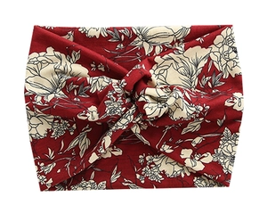 Close-up of floral wide headbands with twisted knot design for yoga and running