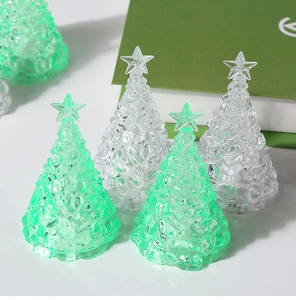 Macro view of crystal-textured LED Christmas tree lamps with a glowing star on top