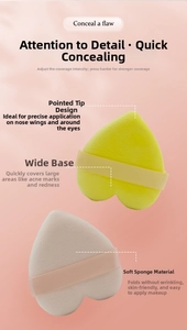 Close-up of heart-shaped makeup sponges in yellow and beige with silk ribbons