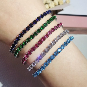 Detail view of colorful tennis bracelets with sparkling round cut zircons in a stack