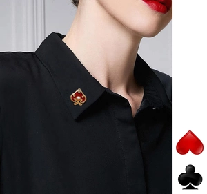 Close-up of a spade poker collar pin with red enamel and pearl on a black shirt collar