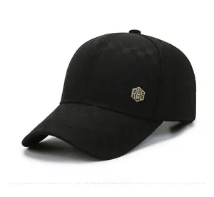 Detail of black plaid baseball cap with hexagonal R2G metal logo on side and matte texture