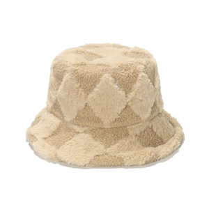 Detail of plush bucket hat featuring a textured beige diamond pattern for winter warmth