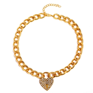 Gold-tone chunky chain necklace featuring a crystal-encrusted heart padlock pendant