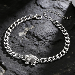 Detail showing vintage silver elephant pendant on chunky curb chain with lobster clasp