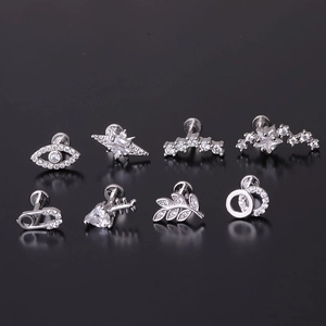 8 styles of 16G stainless steel labret studs with micro-inset zircons on dark background
