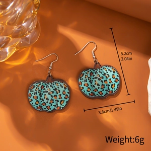 Leopard print pumpkin drop earrings in teal and brown for fall and Thanksgiving