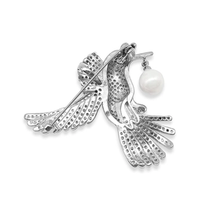 Silver hummingbird brooch with sparkling pavé crystals and a dangling pearl drop