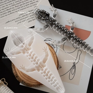 Detailed translucent silicone mold and finished black ink-textured resin lizard with measurements