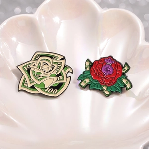 Creative dollar rose and money bag enamel brooches on a decorative shell plate