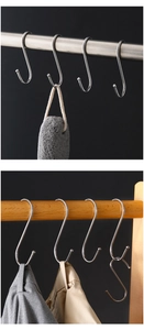 Close-up of stainless steel S-shaped hooks with protective round ends for home storage