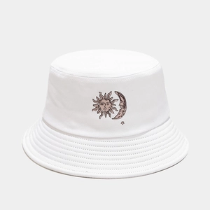 Close-up of sun and moon embroidery on white cotton canvas fisherman bucket hat