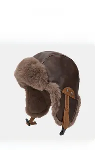 Detail of coffee brown PU leather aviator hat with thick plush lining and buckle strap