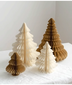 Detail of eco-friendly honeycomb paper Christmas trees in cream and kraft brown colors