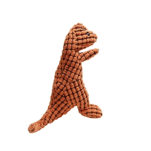 Detailed texture of brown plush dinosaur dog toy with bumpy corn fleece fabric