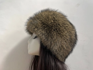 Close-up of brown faux fox fur texture and stitching on a Russian style winter hat