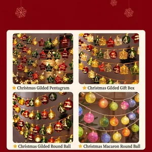 Christmas LED string lights with gold stars, gift boxes and textured baubles ornaments