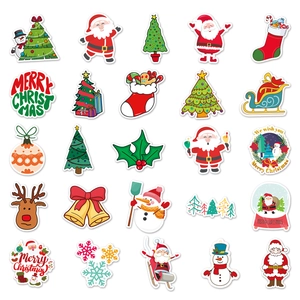 Flat lay of 25 colorful cartoon Christmas stickers including Santa and reindeer designs