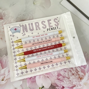 Macro shot of 5-piece nurse theme pen set with humorous slogans and golden clips