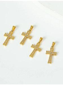 Detailed view of four gold-plated cross pendants with micro-paved sparkling cubic zirconia