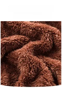 Close-up of soft brown plush fleece fabric on a warm hooded baby winter romper