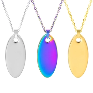 Detailed view of polished oval pendants in silver, gold and rainbow finishes on chains