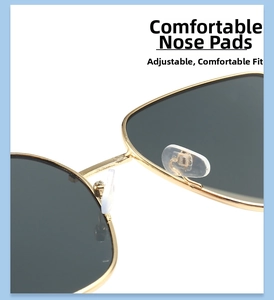 Detailansicht der verstellbaren Silikon-Nasenpads am goldenen Metallrahmen der Sonnenbrille