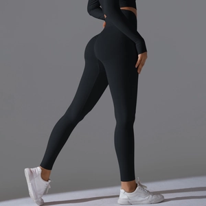 Detail view of high waist sculpting black yoga leggings and long sleeve sports top set