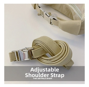 Detail of off-white adjustable shoulder strap with silver buckle for minimalist handbags