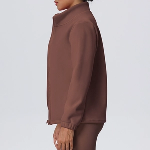 Detail view of coffee brown sports jacket featuring stand collar and smooth zipper closure