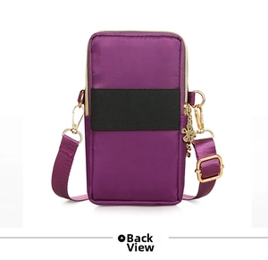 Back view of purple nylon crossbody phone bag with wide elastic band and gold flower charm