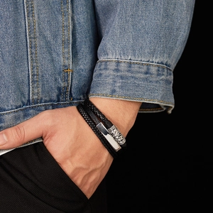 Close-up of black multilayer braided leather bracelet with silver magnetic metal clasp
