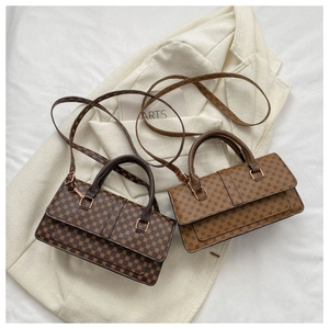 Detailed view of two vintage crossbody bags with polka dot patterns on linen fabric