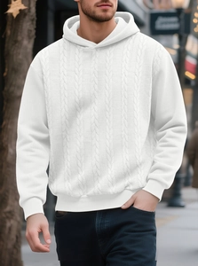 Close-up of white cable knit pattern and texture on a men's thick hooded sweater
