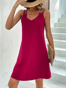 Detail of the deep red sleeveless V-neck dress with a slim fit and elegant silhouette