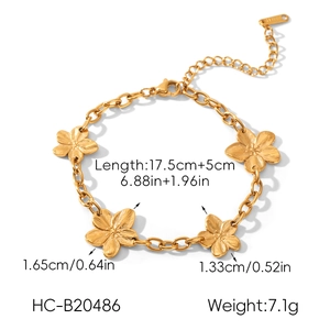 Detailed macro view of a gold-toned flower bracelet featuring five carved floral elements