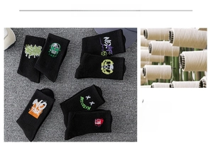 Detail of black mid-calf cotton sports socks with rib knit and street style embroidery