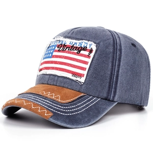 Detailed view of the American flag patch embroidery on a vintage washed baseball cap