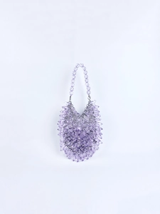 Detailed view of purple faceted acrylic beads on a handmade evening clutch handbag