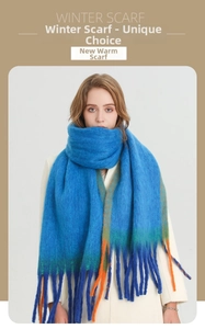 Detail of blue mohair-textured scarf featuring orange and green contrast stripes and long tassels