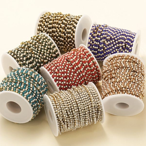 Macro view of crystal and pearl chain rolls for DIY jewelry making accessories