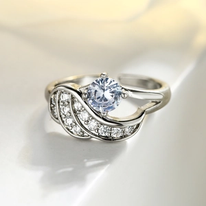 Adjustable silver wing ring with sparkling zircon stones in a sleek 18k gold plated design