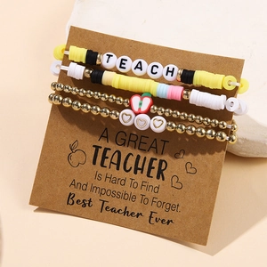 Detailed set of 4 polymer clay and gold bead bracelets featuring TEACH lettering and apple charm