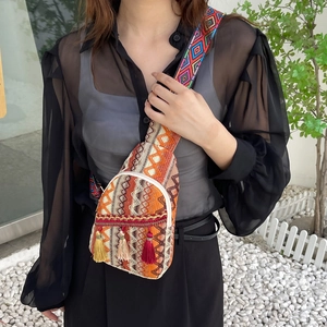 Ethnic woven crossbody bag with colorful fringe and bohemian jacquard strap for women