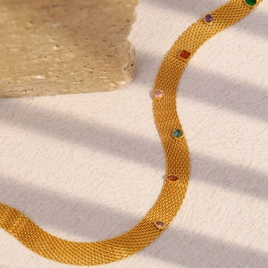 Close-up of gold mesh chain necklace featuring vibrant multi-color zircon gemstones